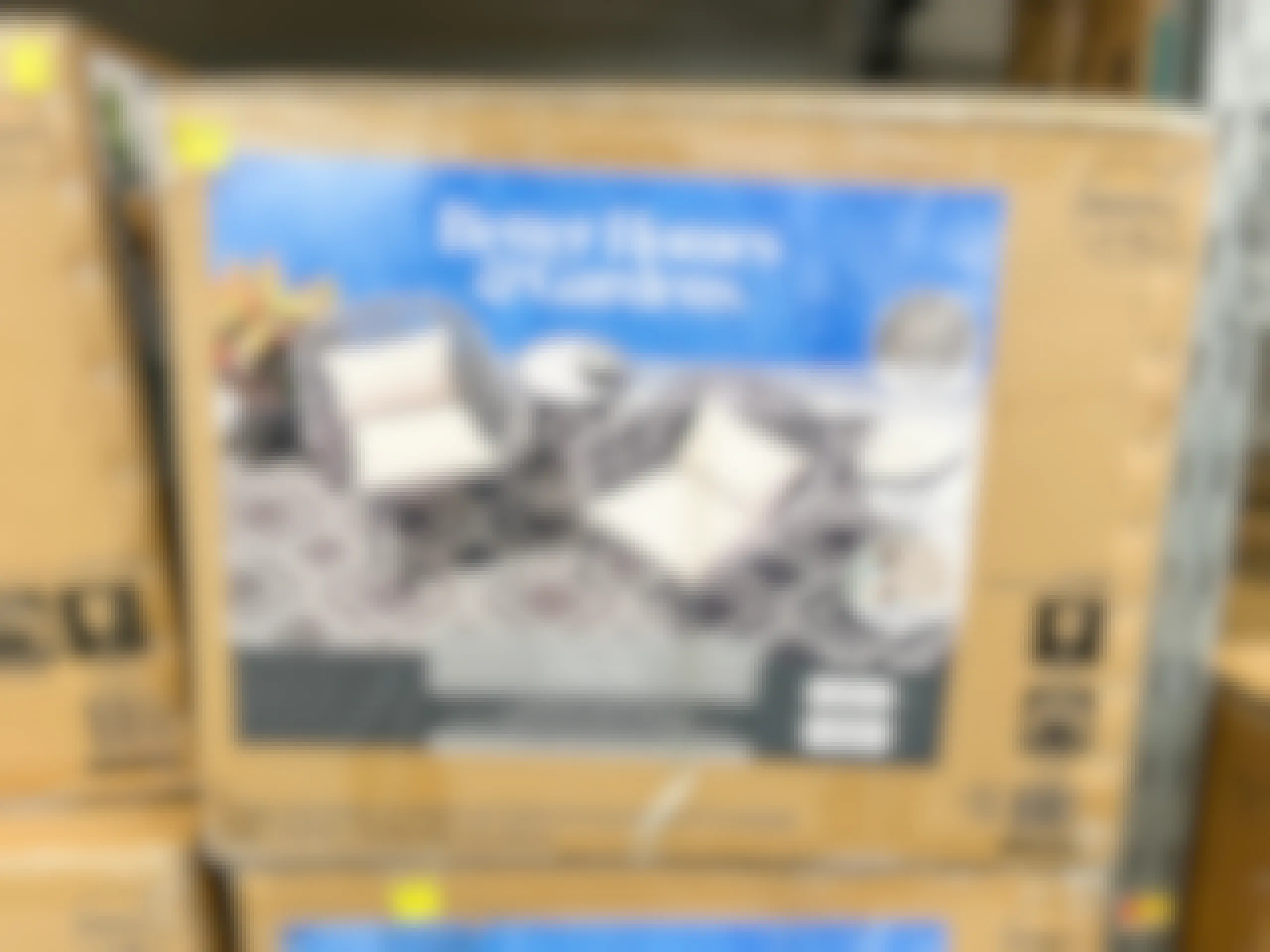box of Walmart patio furniture on clearance