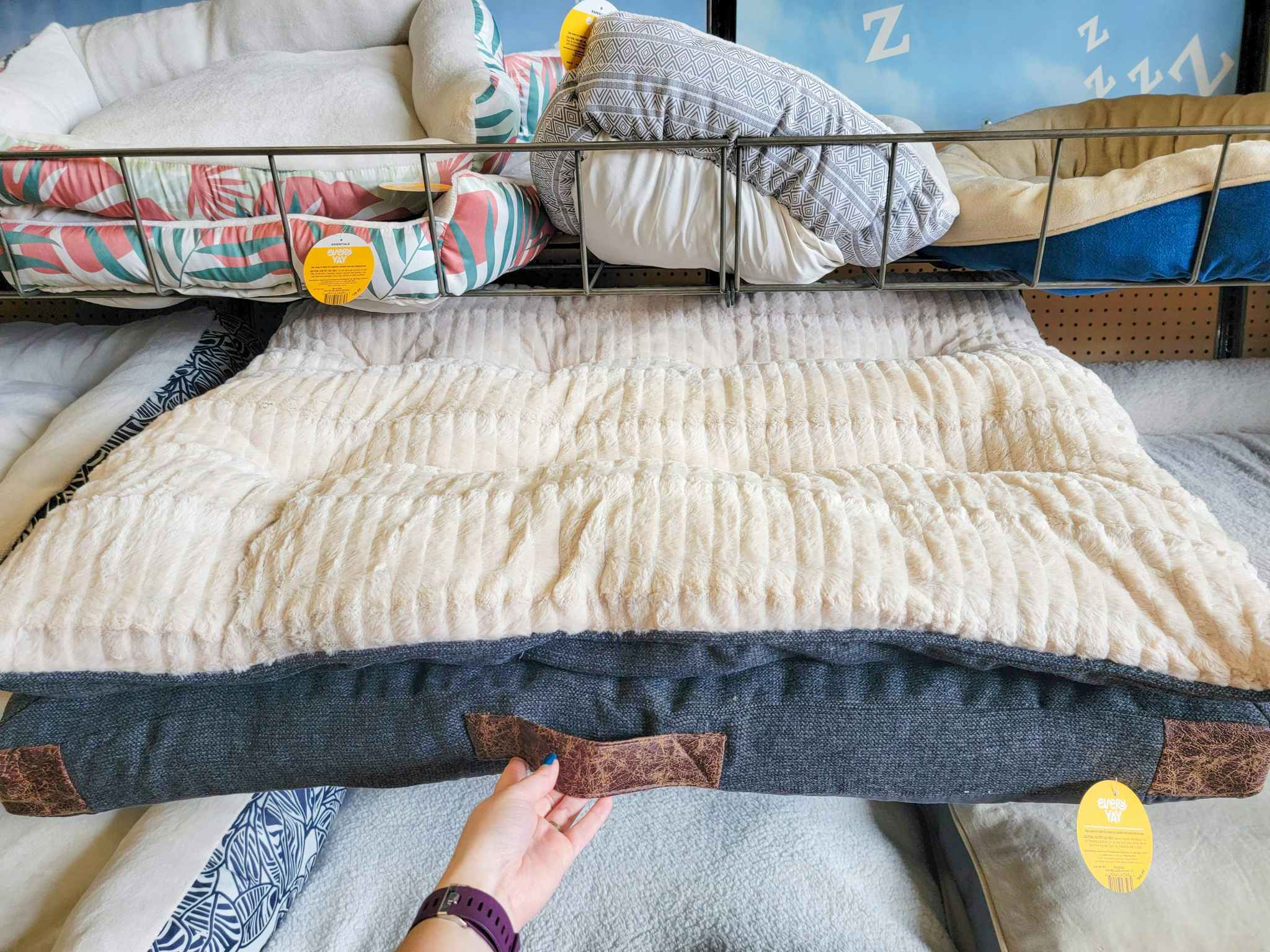 large dog bed with a leather handle