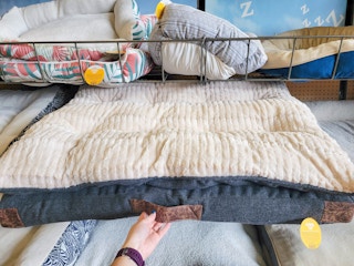 large dog bed with a leather handle