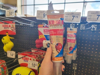 hand holding a kong stuff'n sweet potato flavor