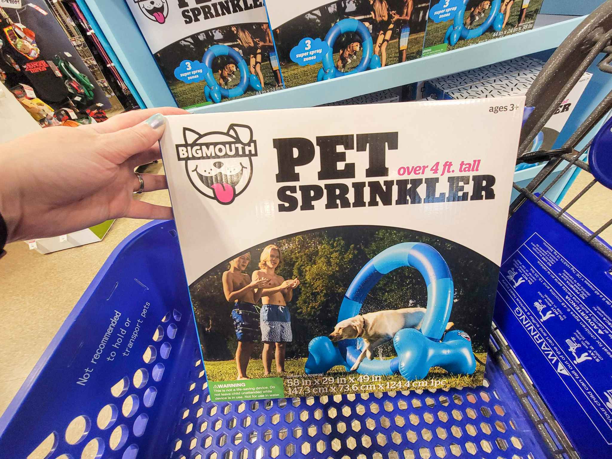 a 4 foot tall pet sprinkler in a cart