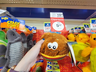 hand holding a burger dog toy