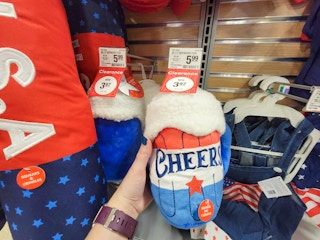 hand holding a cheers usa dog toy