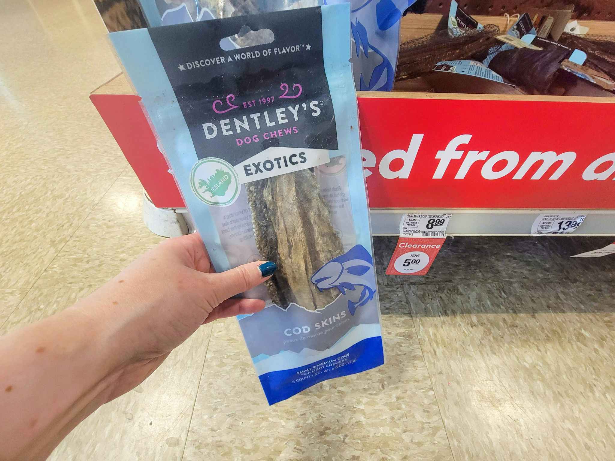 hand holding a bag of cod skin dog chews