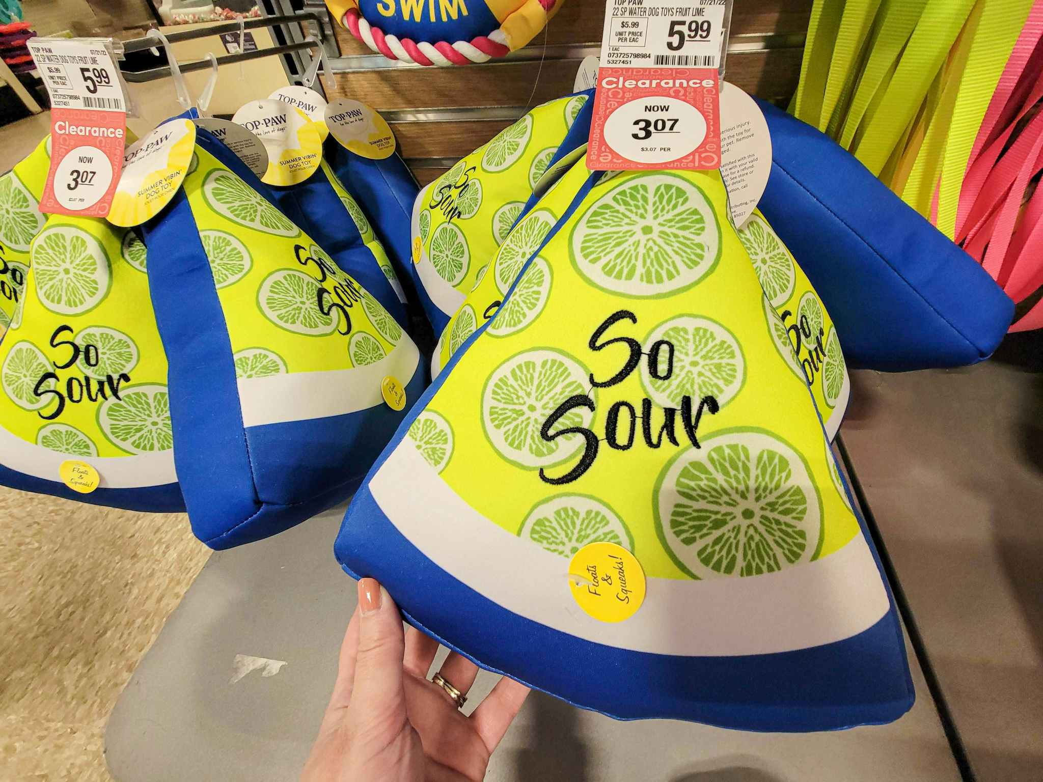 a lime dog toy that says so sour