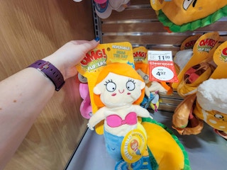 hand holding a mermaid dog toy