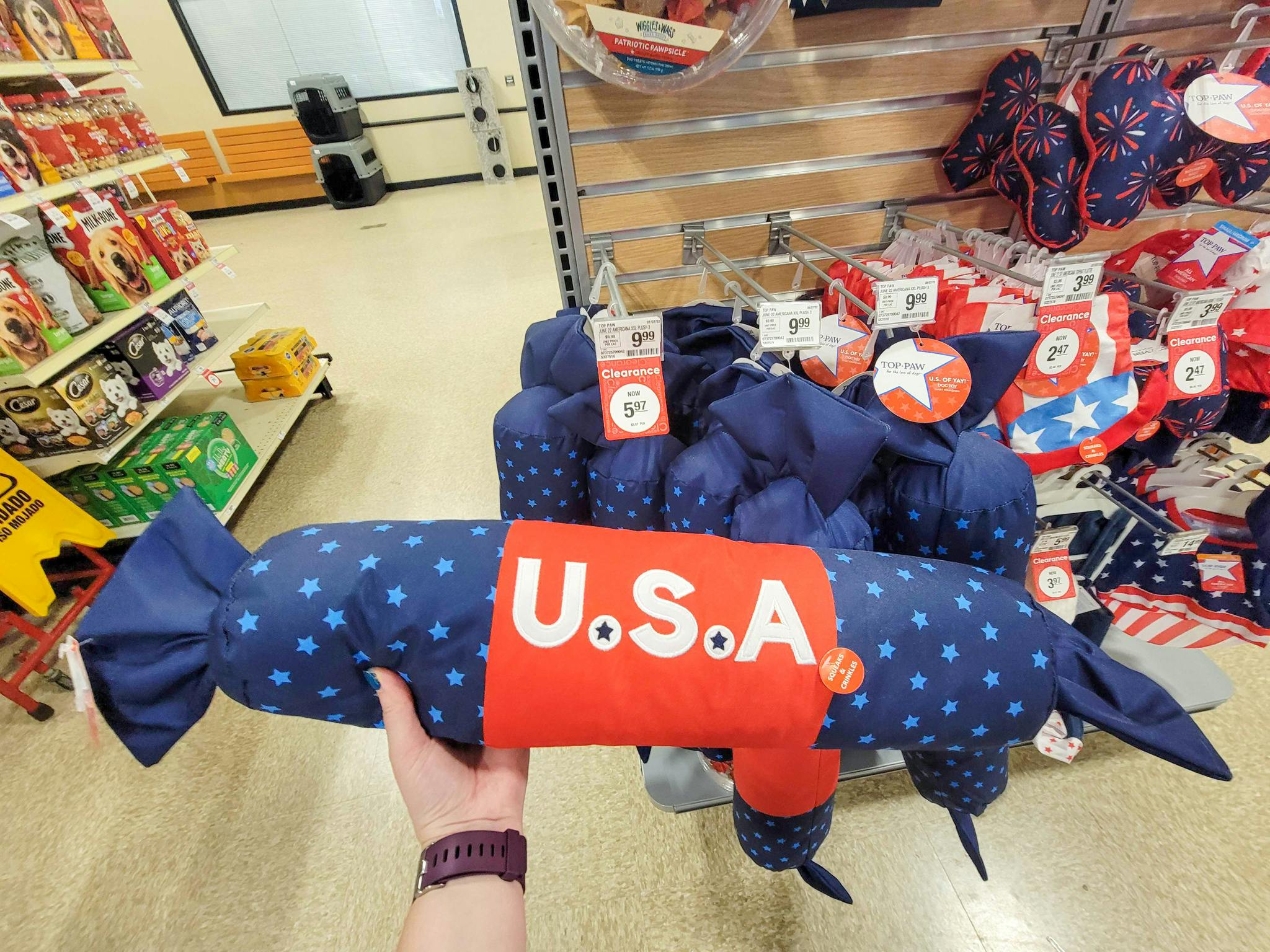 hand holding a large usa dog toy