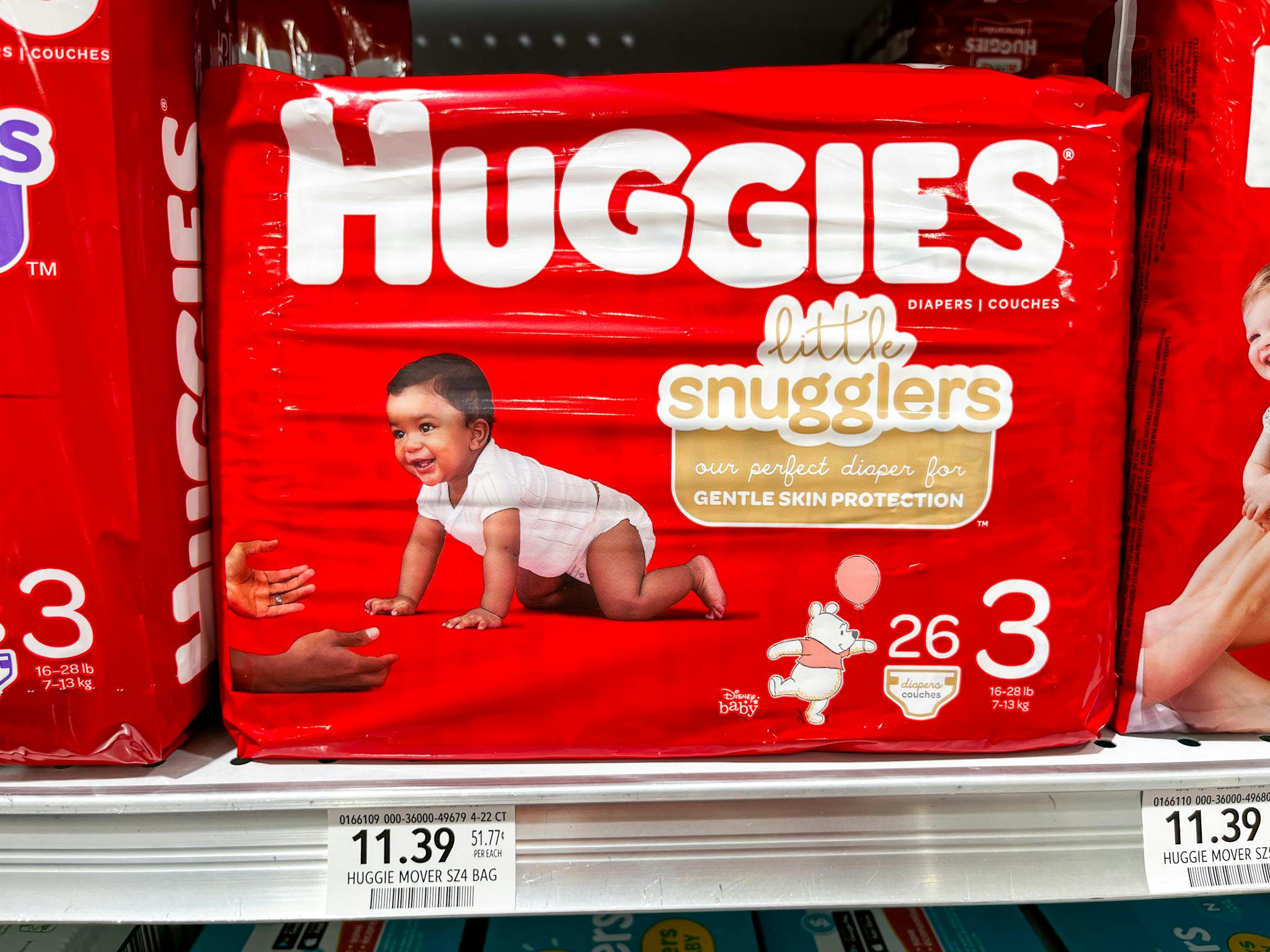 A pack of Huggies Little Snugglers diapers on a store shelf.