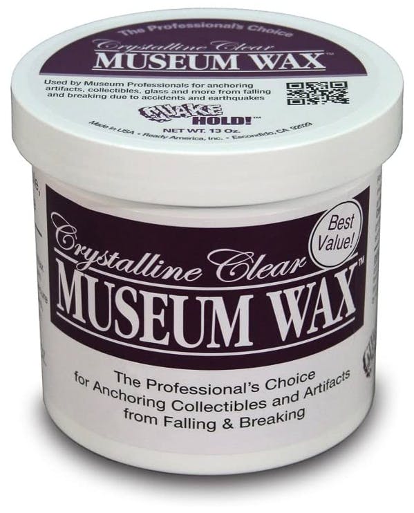 A container of Quakehold! Museum Wax on a white background.