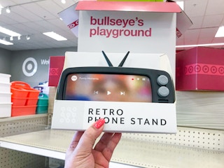 hand holding up retro phone stand box at Target