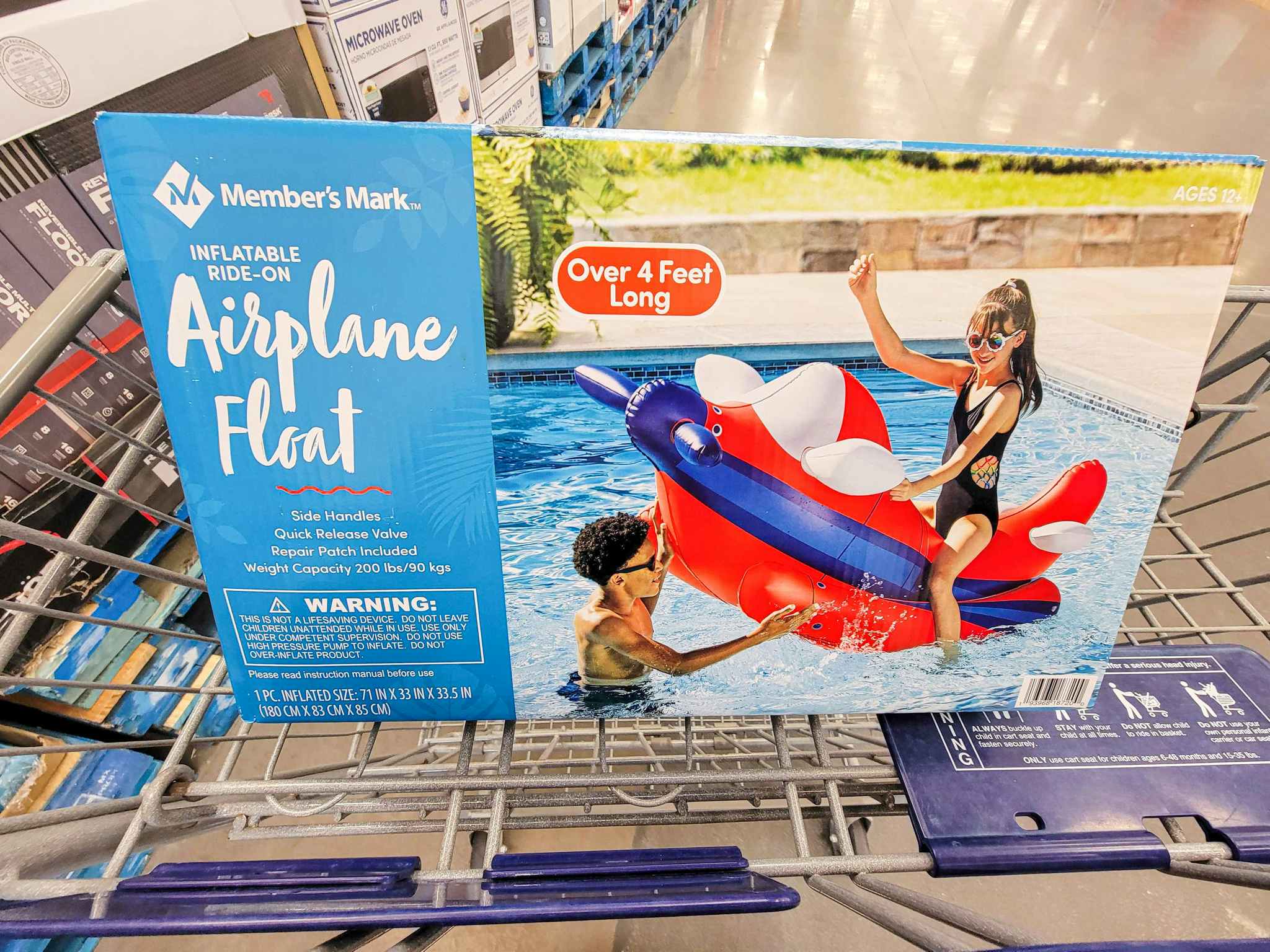 a large rocket pool float in a cart
