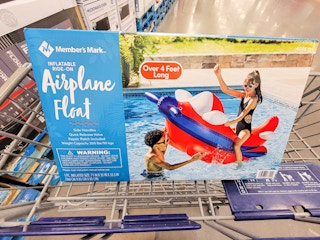 a large rocket pool float in a cart