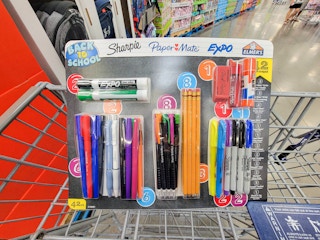 a back to school kit in a cart, containing pencils, pens, sharpies, dry erase markers, etc