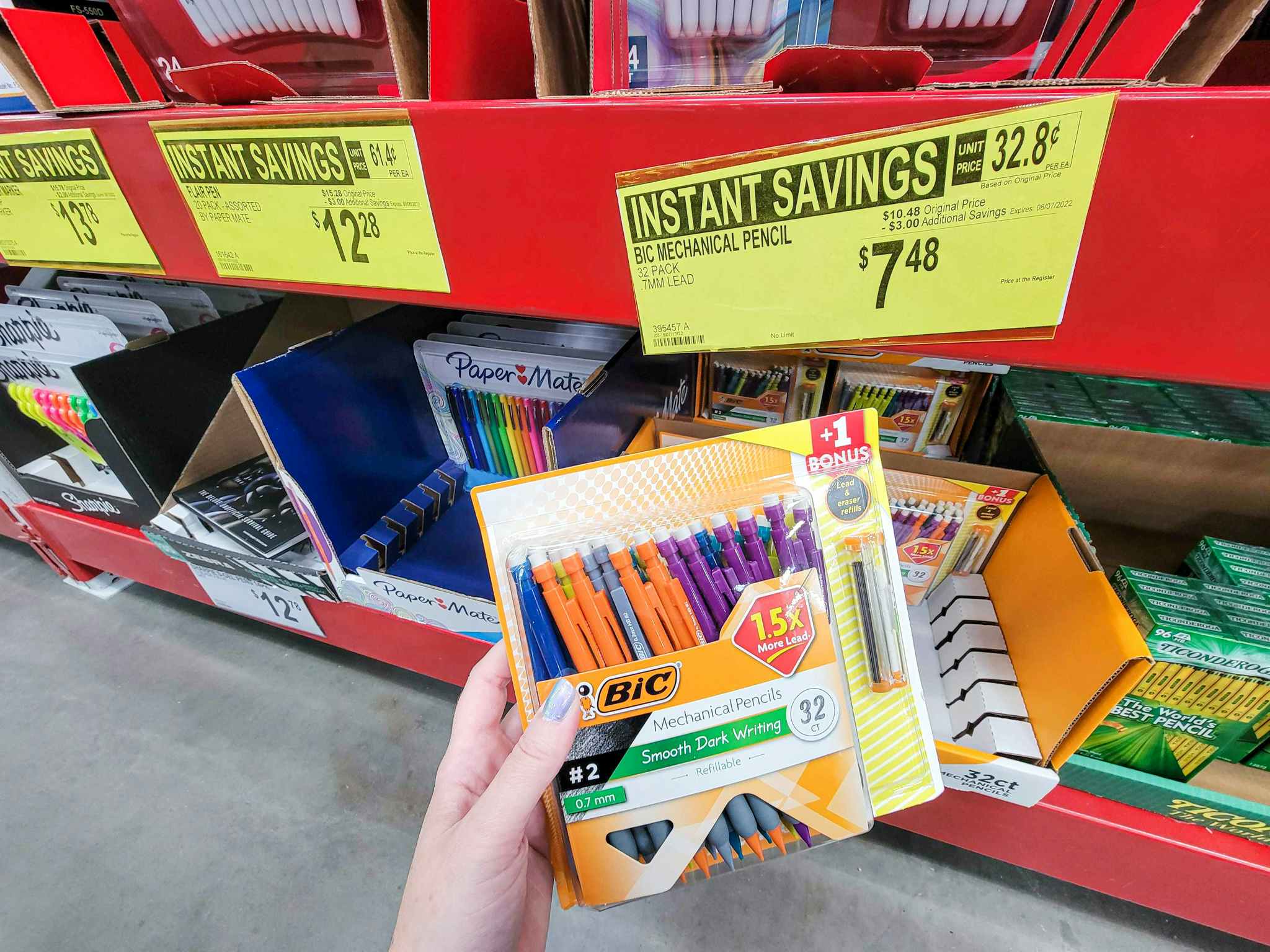 hand holding a pack of 32 bic mechanical pencils