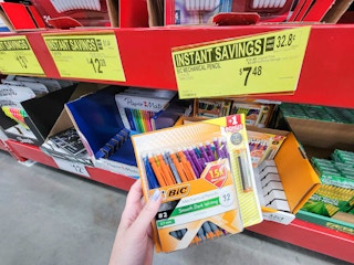 hand holding a pack of 32 bic mechanical pencils