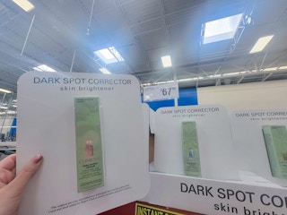 hand holding a clinique dark spot corrector