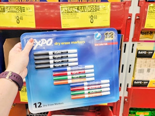 hand holding a pack of 12 expo dry erase markers