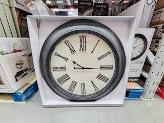 a 30 inch farmhouse wall clock with a black frame