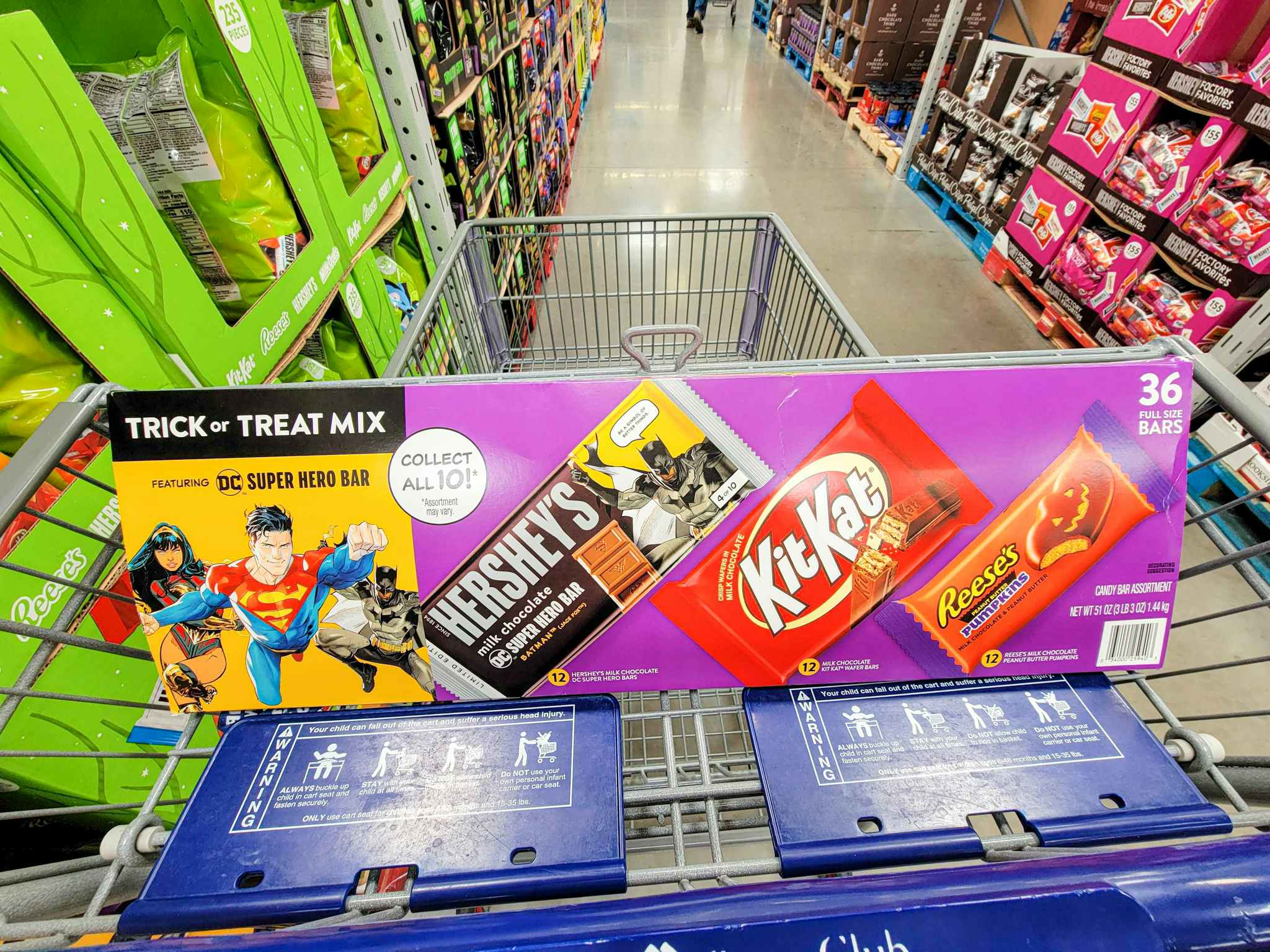 box of full size candy bars for halloween in a cart