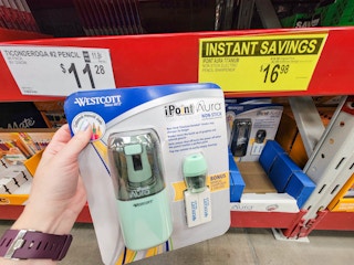 hand holding up a pencil sharpener