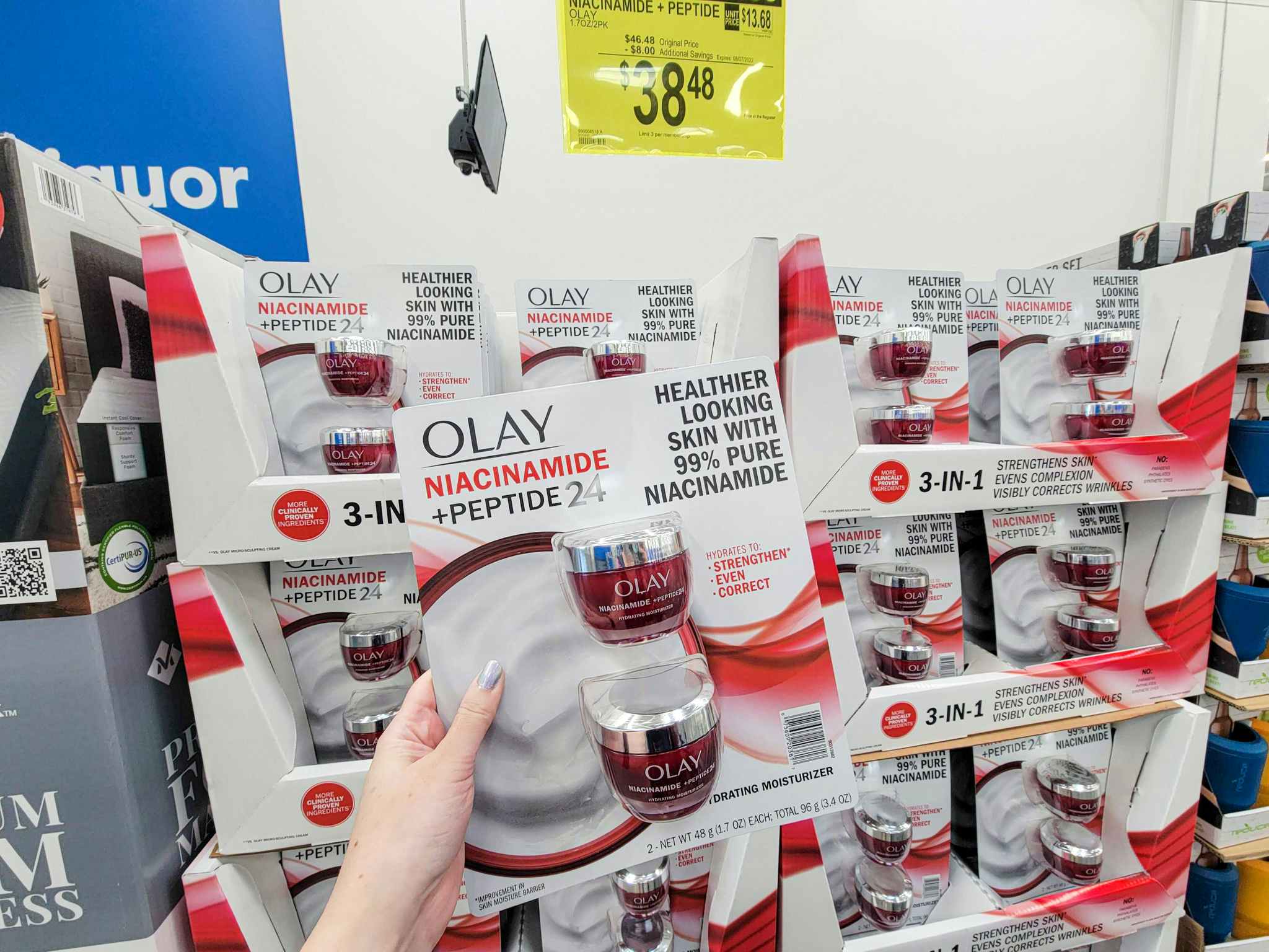 hand holding a 2 pack of olay niacinamide moisturizer