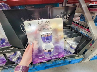 hand holding a 2 pack of olay retinol moisturizer