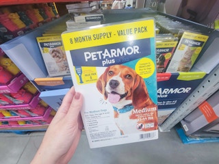 hand holding a pack of petarmor flea and tick prevention for dogs