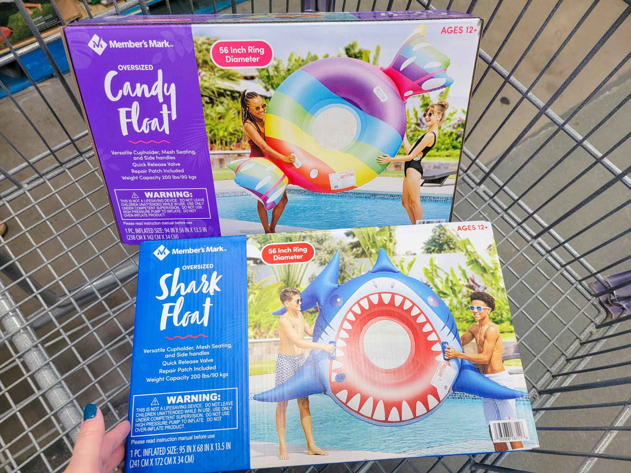 large pool floats in a cart, one is a piece of candy, one is a shark