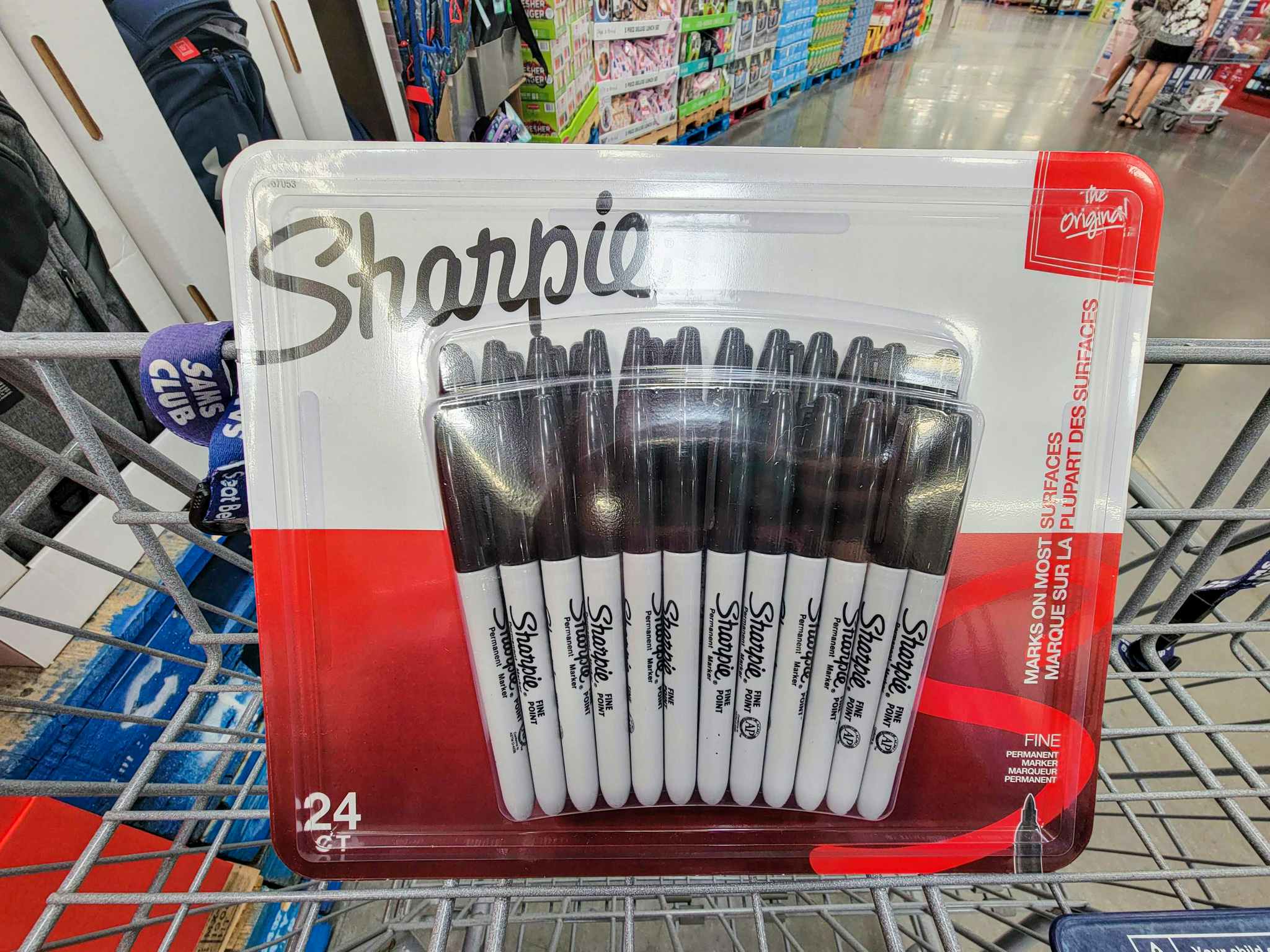a pack of 24 black sharpies in a cart
