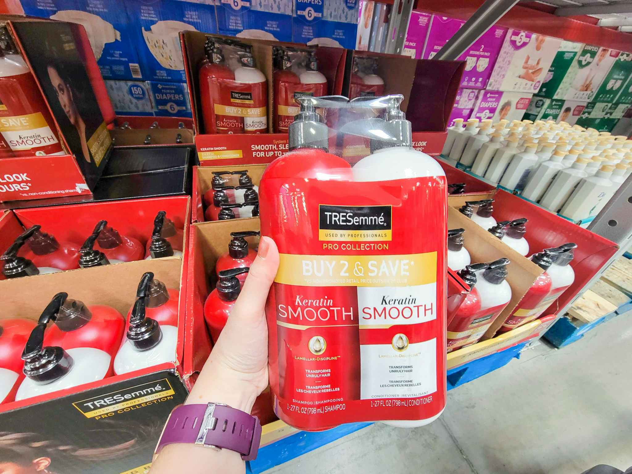 hand holding a 2-pack of tresemme shampoo and conditioner