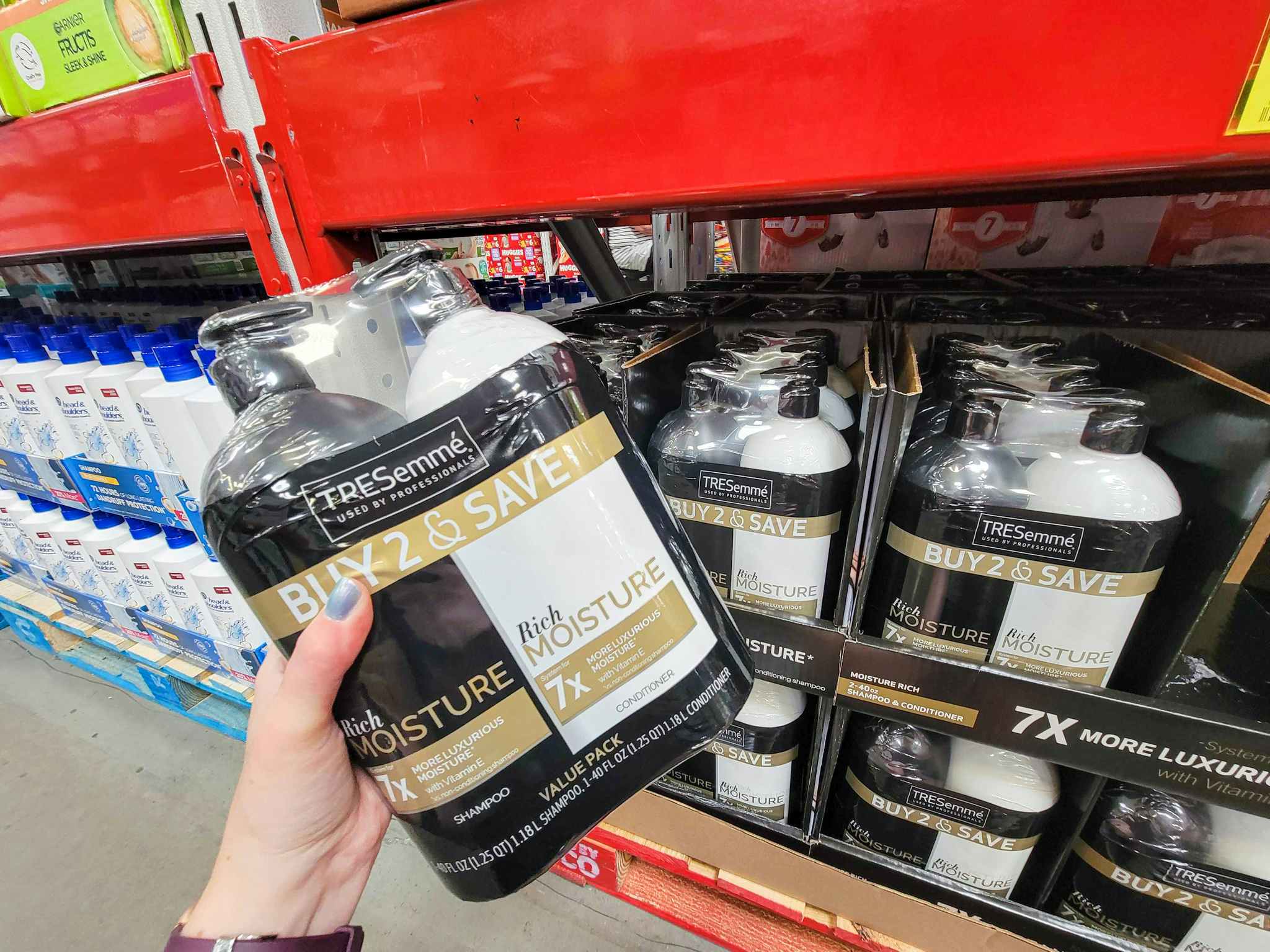 hand holding a 2 pack of tresemme shampoo and conditioner