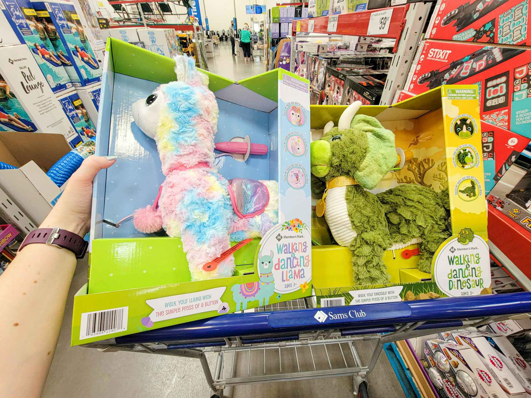 walking plush llama and dinosaur toys in a cart