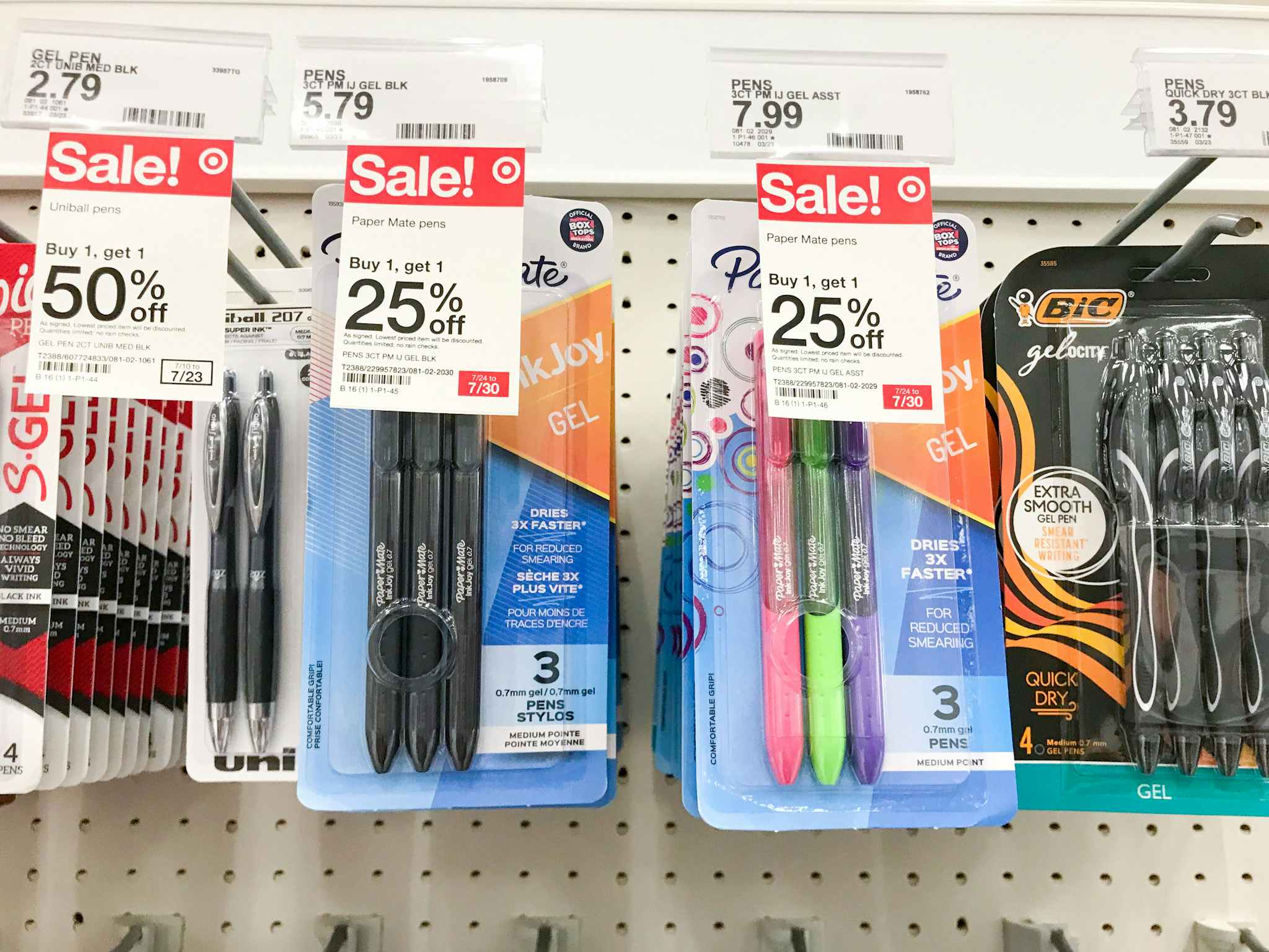 Paper Mate pens hanging in the school supplies aisle at Target with signs that say buy 1, get 1 25% off