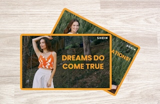 two shein gift cards overlapping on hardwood floor