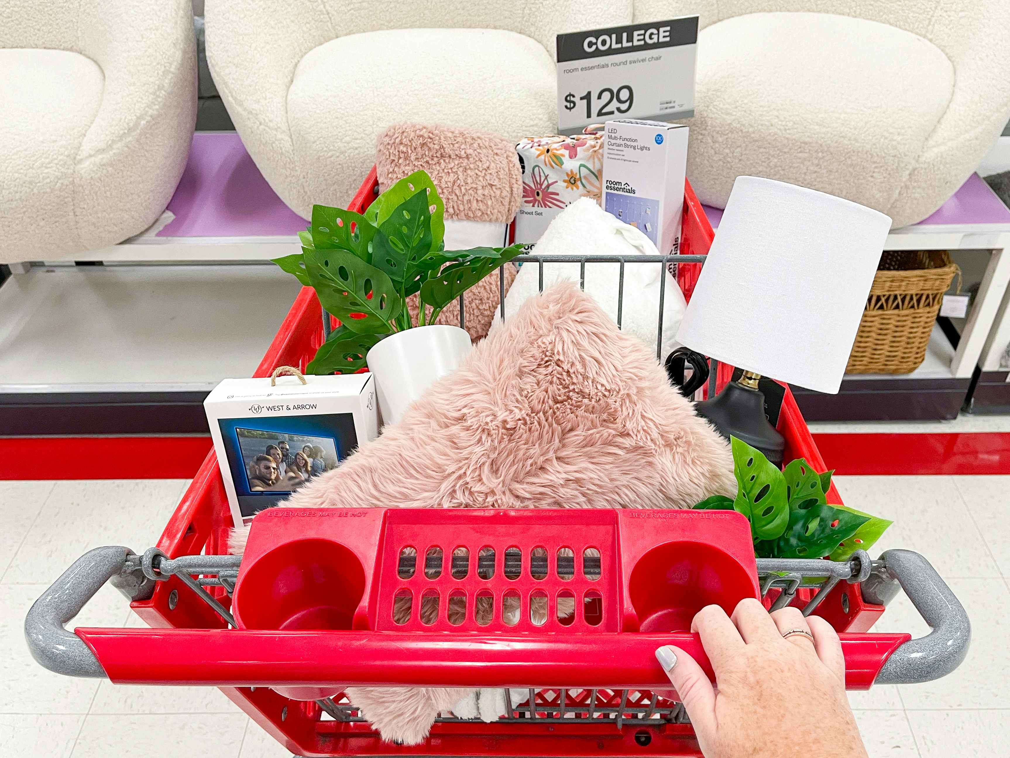 A Target shopping cart filled with various items from Target's College shop.