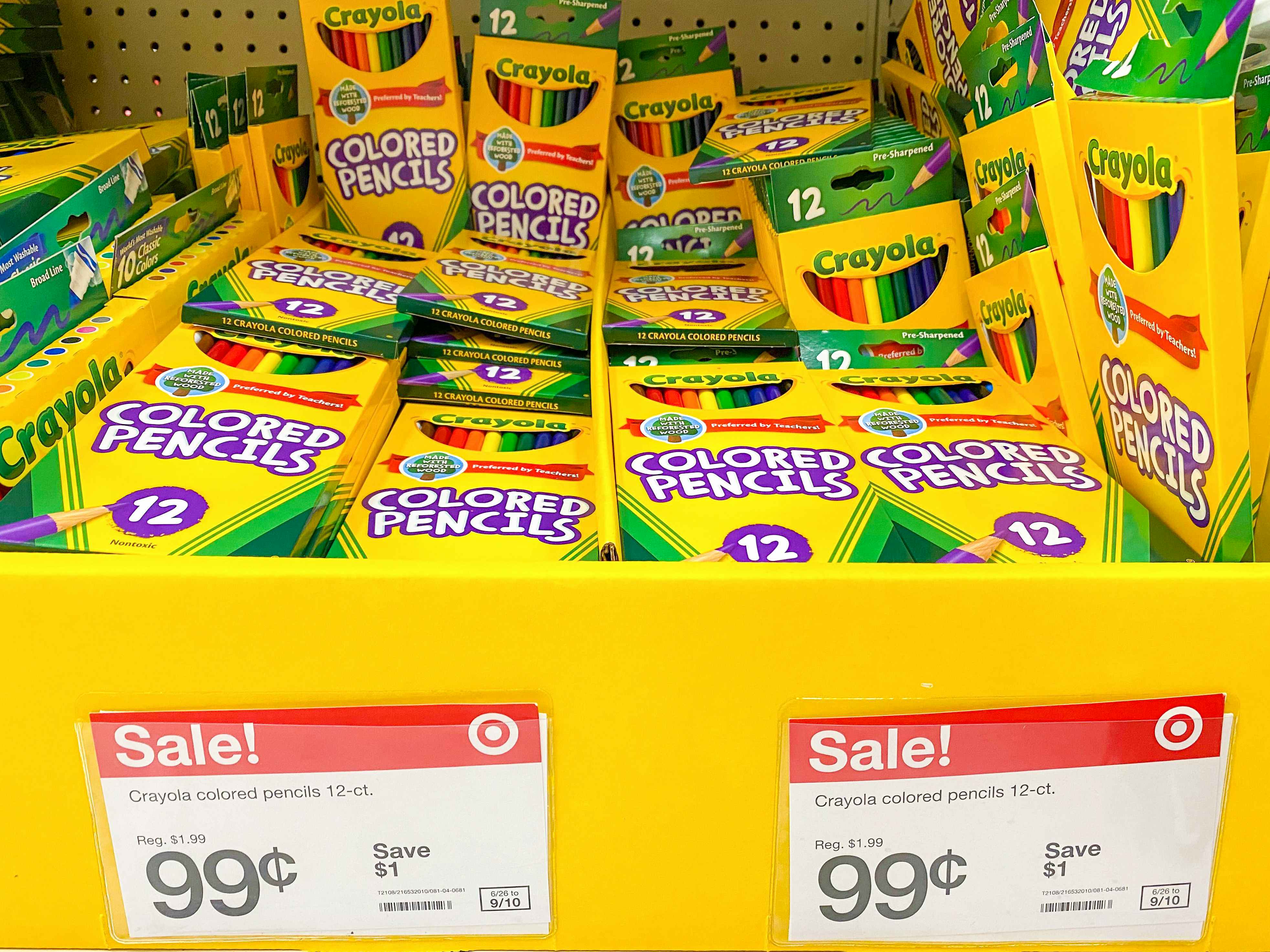 Crayola colored pencils on display at Target with sale signs pricing them at 99 cents.