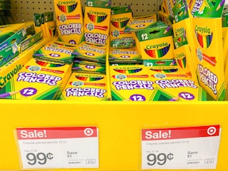 Crayola colored pencils on display at Target with sale signs pricing them at 99 cents.