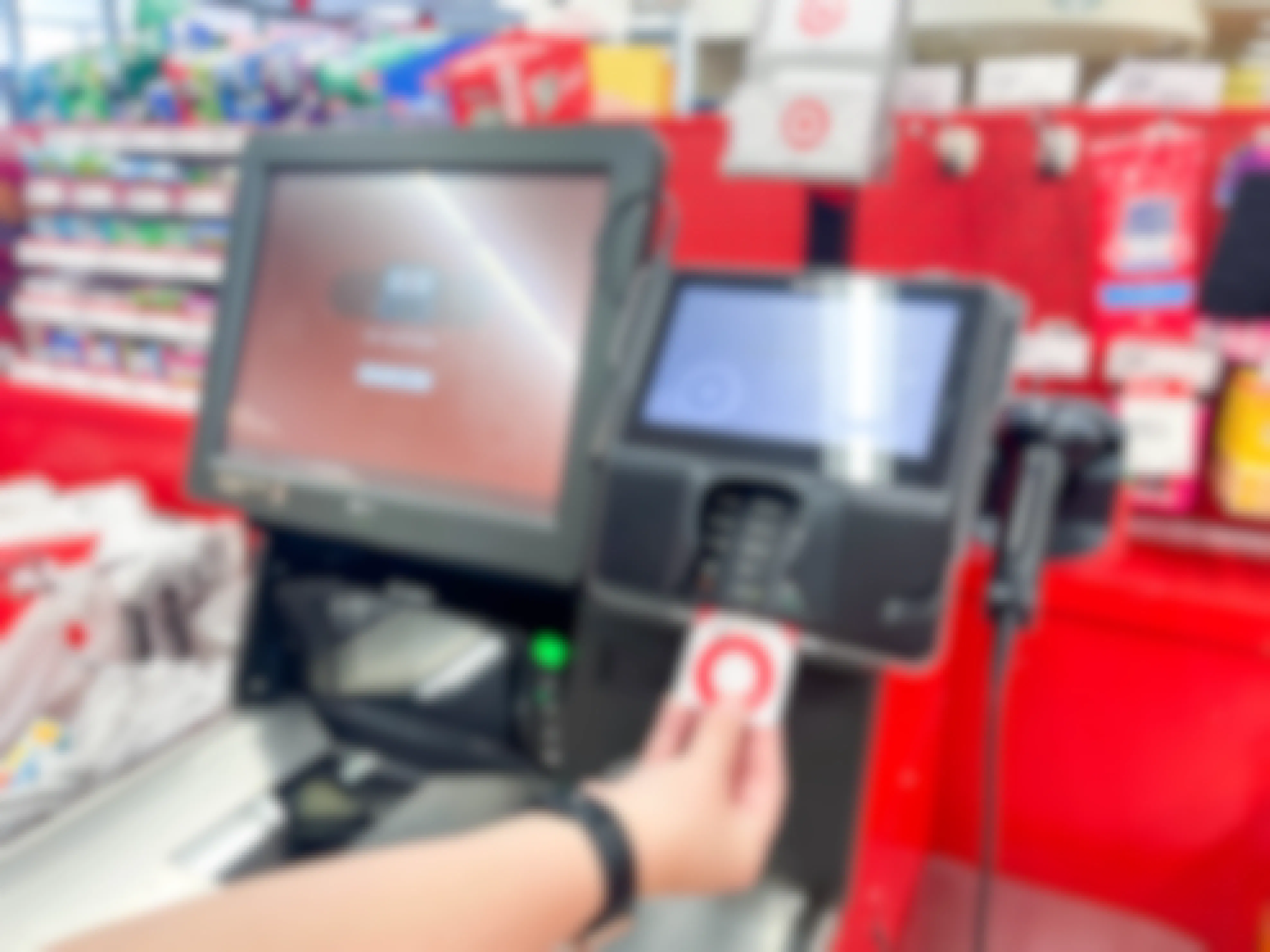 a person using a target red card at self checkout at target
