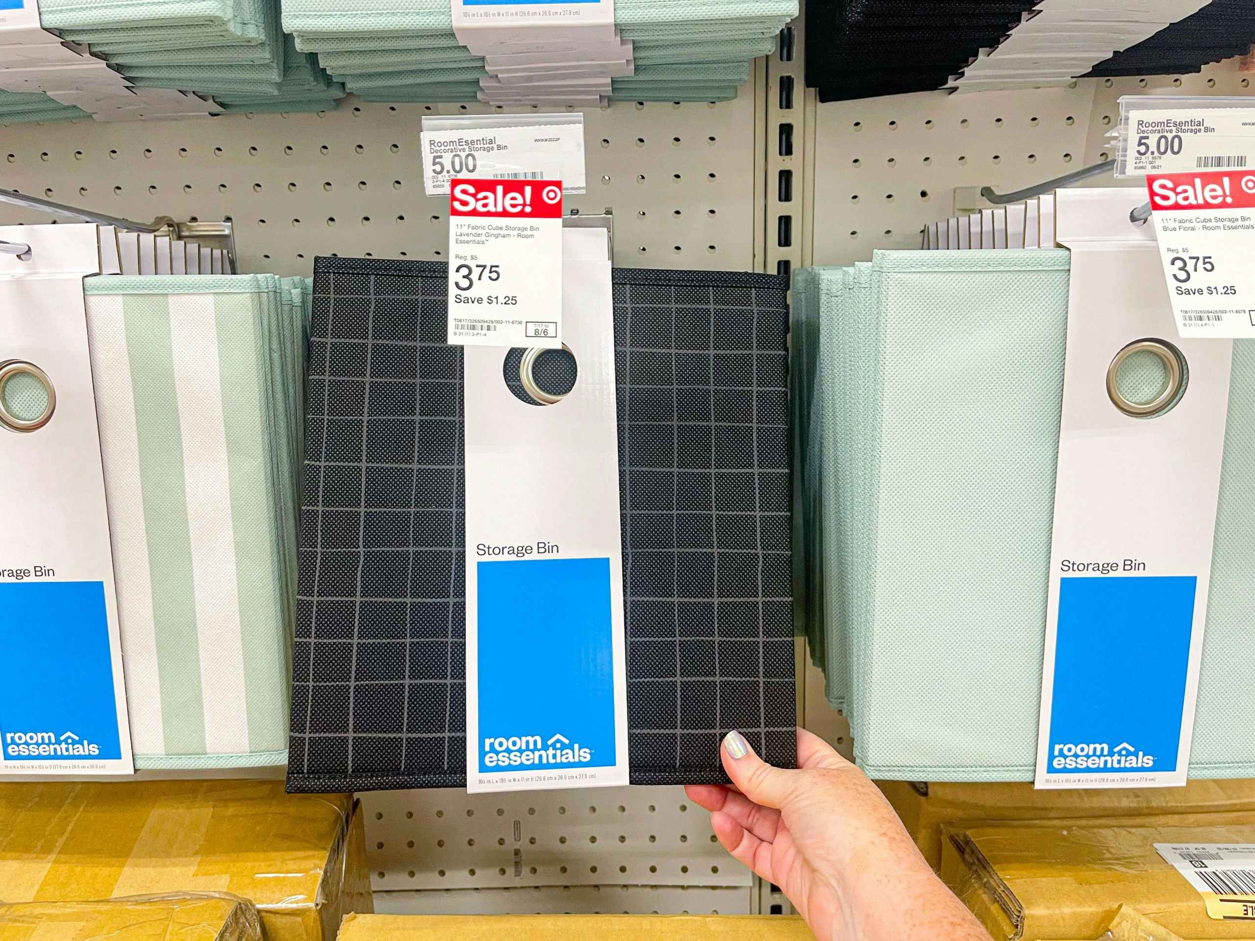 hand holding room essentials black pattern cube storage bin at target