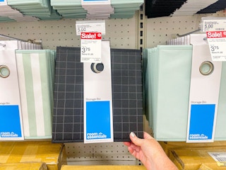 hand holding room essentials black pattern cube storage bin at target