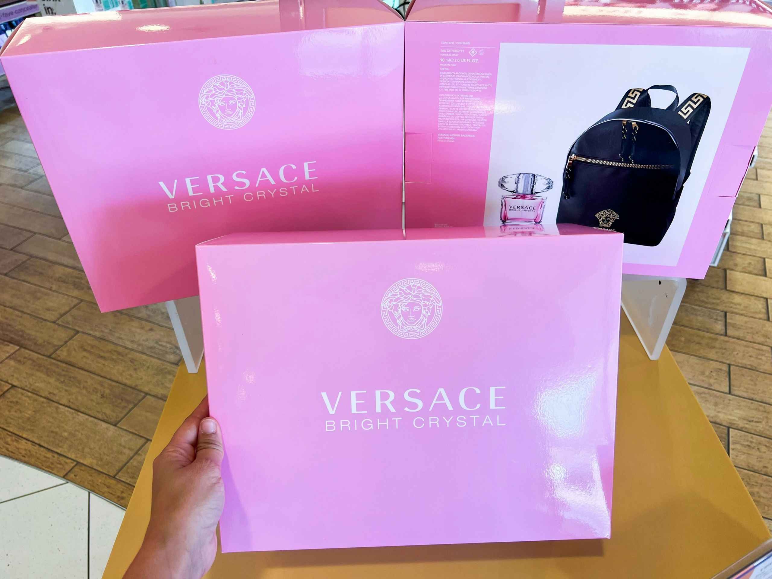 someone holding Versace Bright Crystal Summer Backpack Set