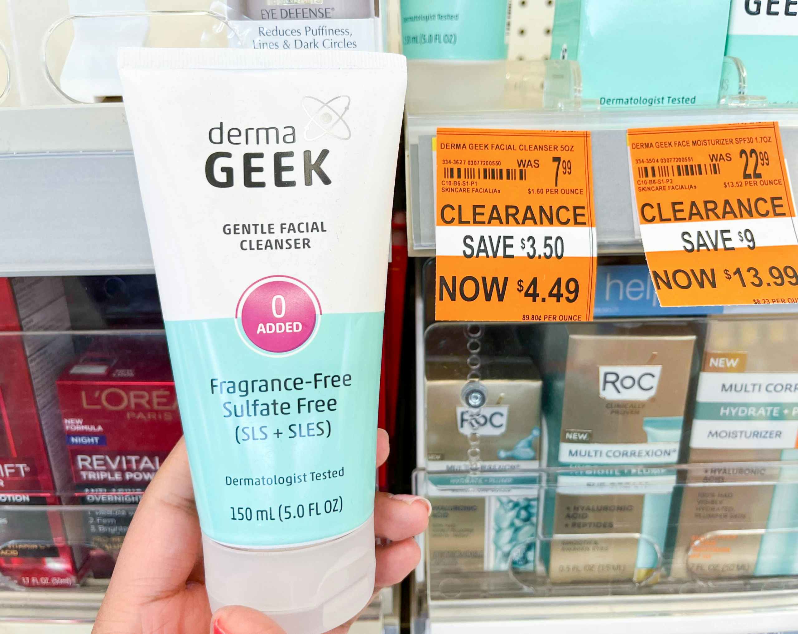 hand holding bottle of DermaGeek facial cleanser next to clearance tag