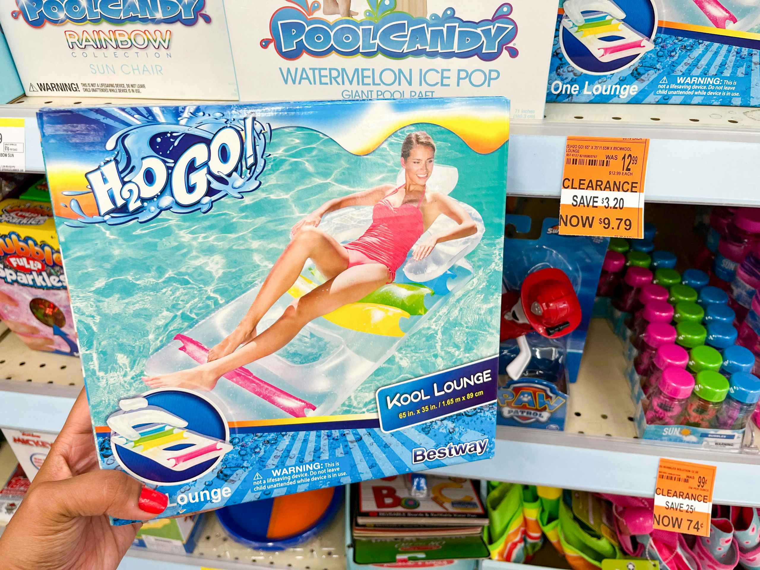 hand holding box with an H2O Go Kool Lounge Float next to clearance tag