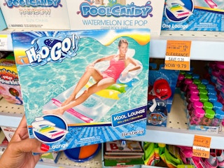 hand holding box with an H2O Go Kool Lounge Float next to clearance tag