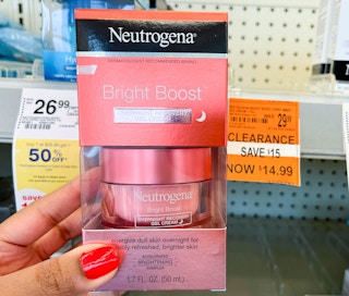 hand holding Neutrogena Bright Boost gel cream with clearance tag next to it