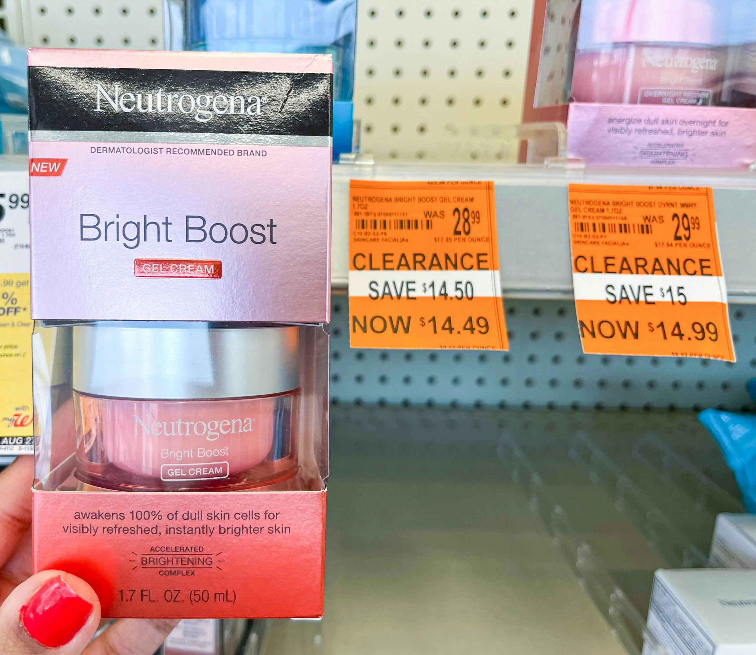 hand holding Neutrogena Bright Boost cream with clearance tag next to it