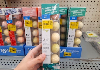 Hand holding Cocktail Bombs product at Walmart. Clearance tag indicates that the price is $1, regularly $6.98.