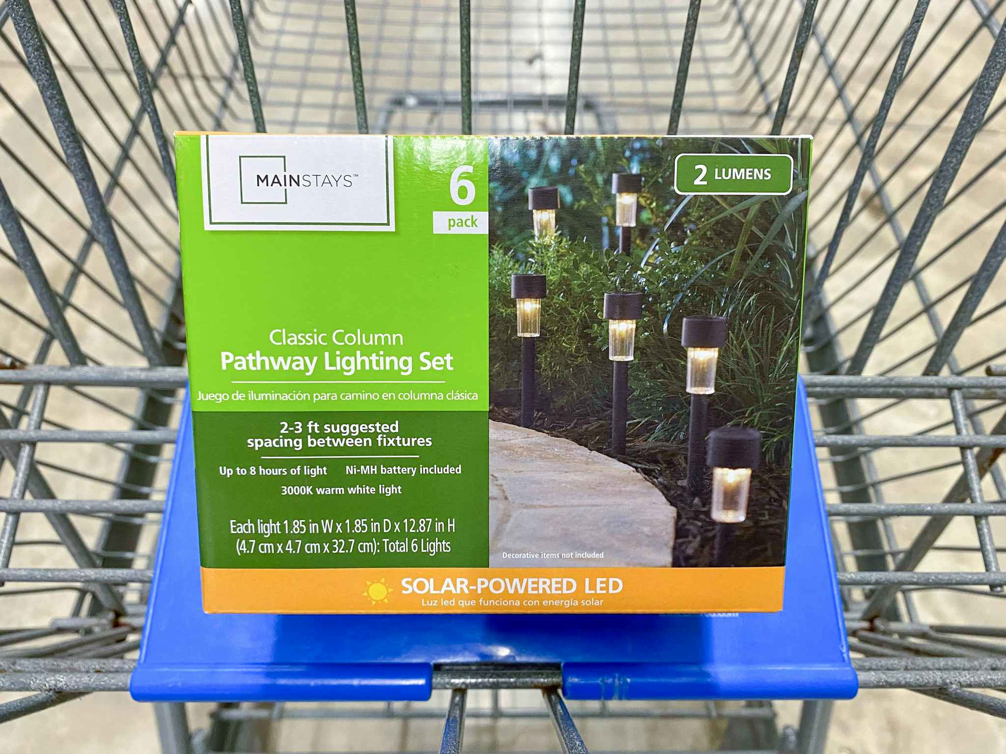 A box of six Mainstays Solar Lights in a Walmart shopping cart