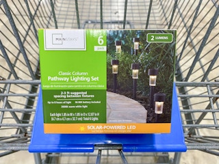 A box of six Mainstays Solar Lights in a Walmart shopping cart