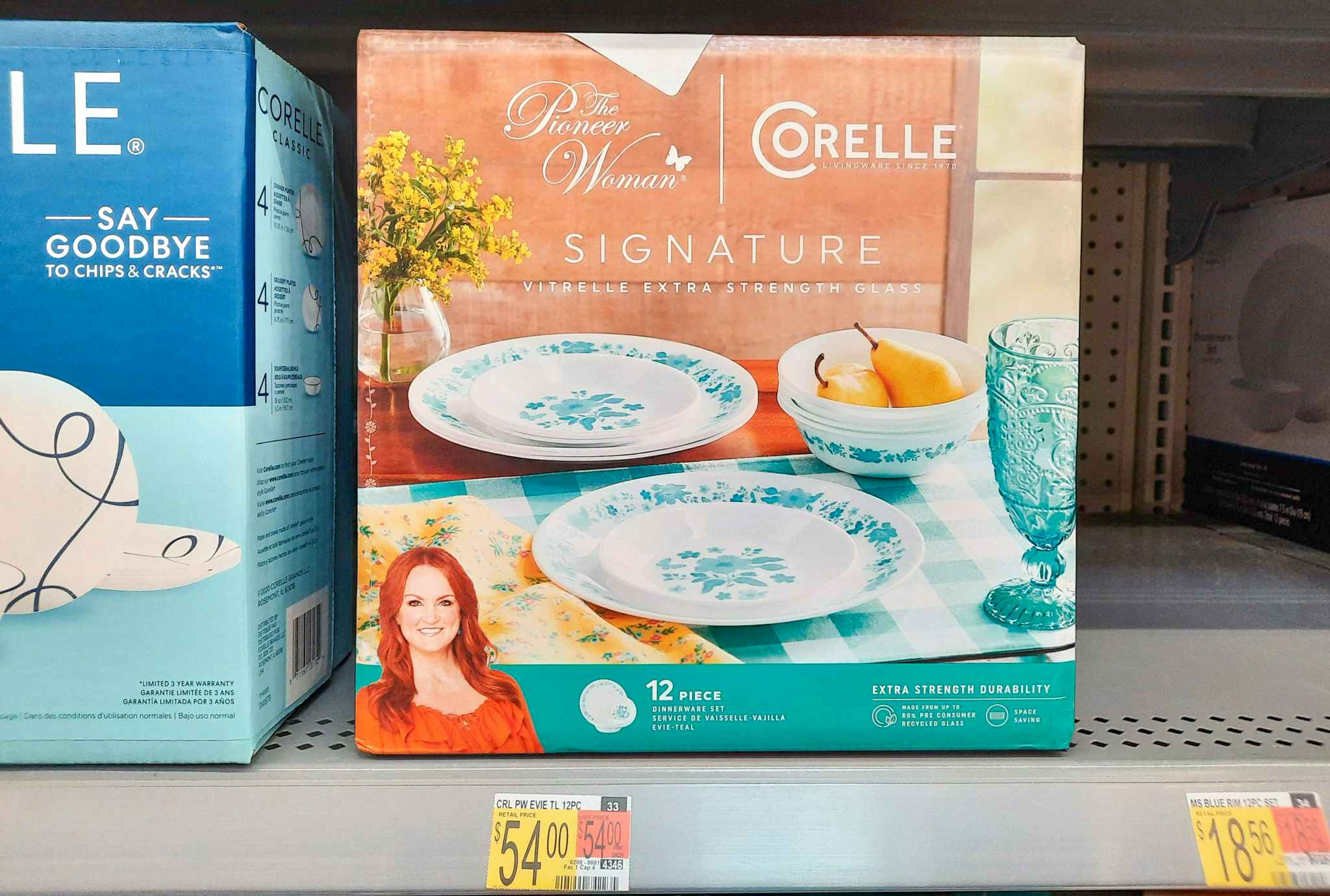 The Pioneer Woman by Corelle 12-Piece Dinnerware set on shelf at Walmart. Price tag indicates that the price is $54.